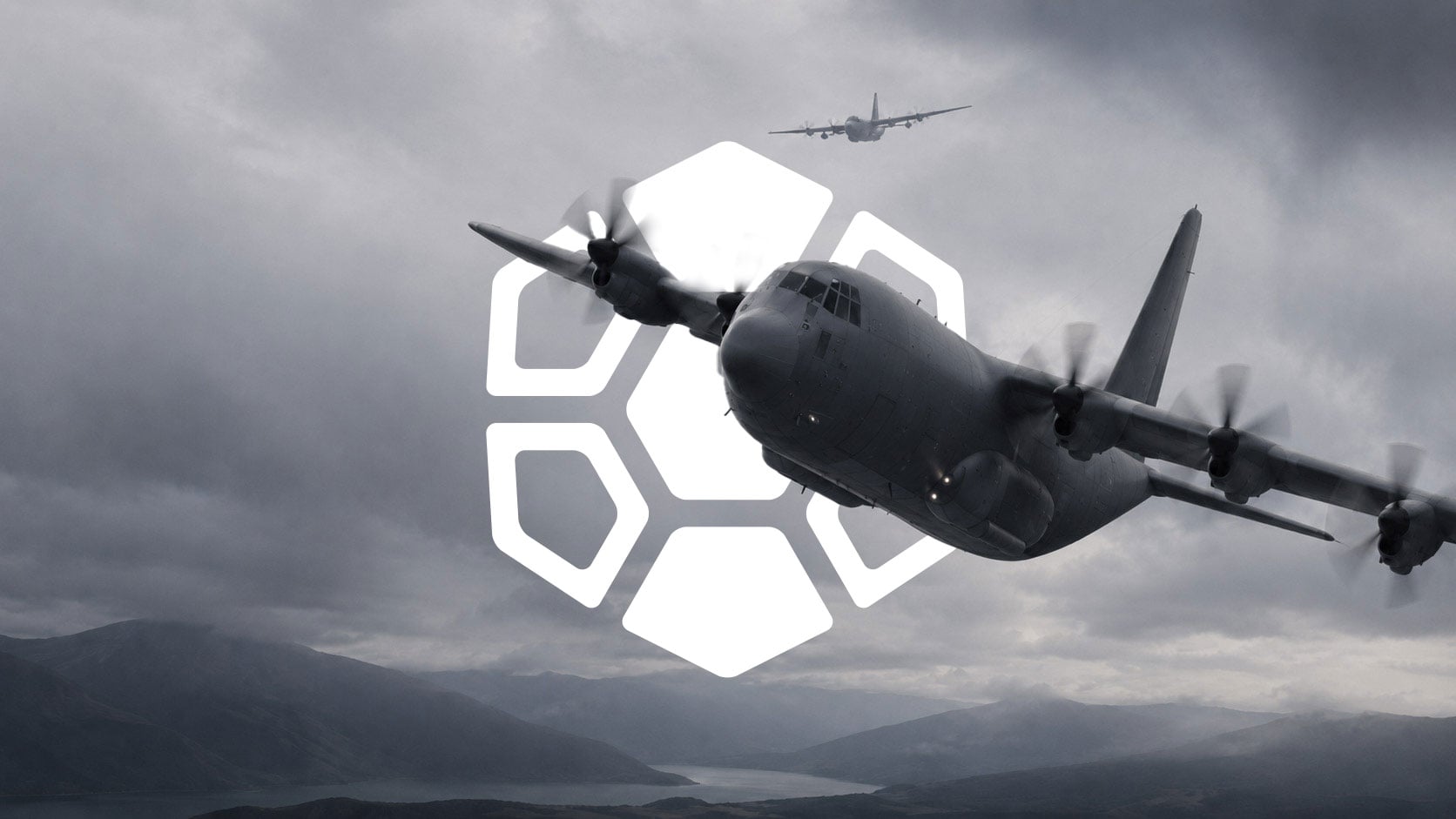 Military transport aircraft flying over mountainous terrain with the Diamondback Solutions geometric brand mark