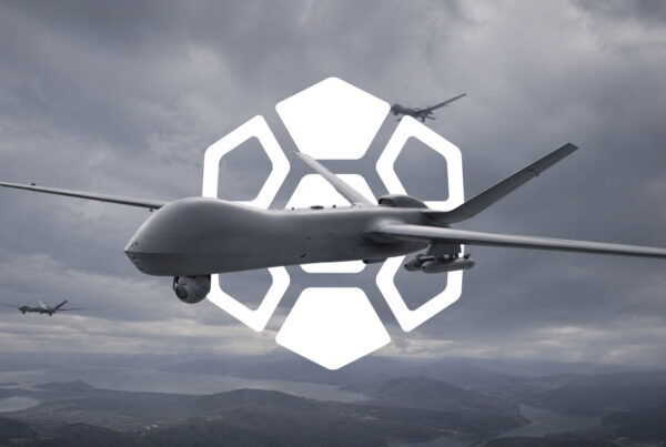 Military unmanned aircraft flying over mountainous terrain with the Diamondback Solutions geometric brand mark