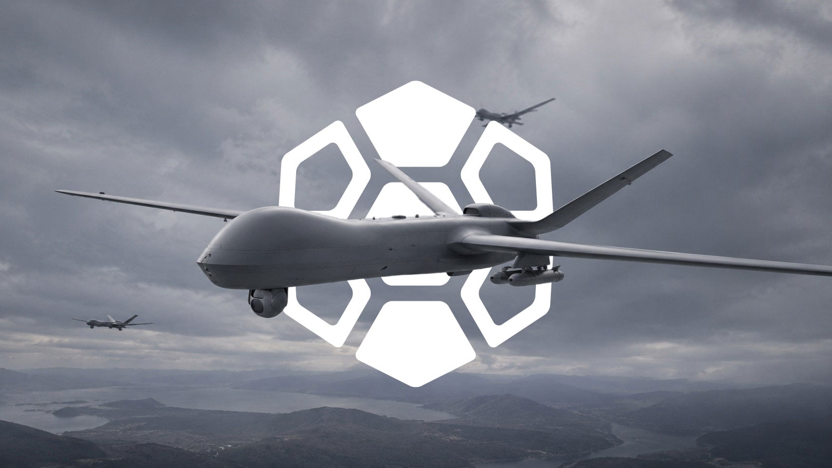 Military unmanned aircraft flying over mountainous terrain with the Diamondback Solutions geometric brand mark