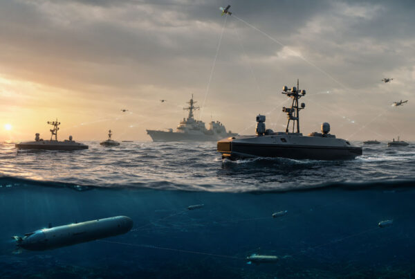 Autonomous naval drones, unmanned surface vessels, underwater vehicles, aircraft, and a U.S. warship operating across a connected maritime network at sea